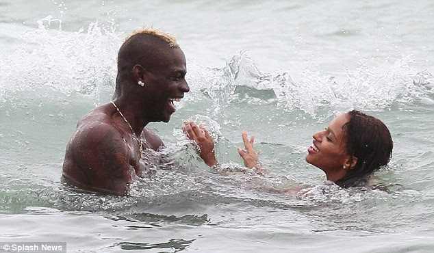 Laugh out loud: The pair looked every inch a completely loved-up couple as they frolicked in the sea together