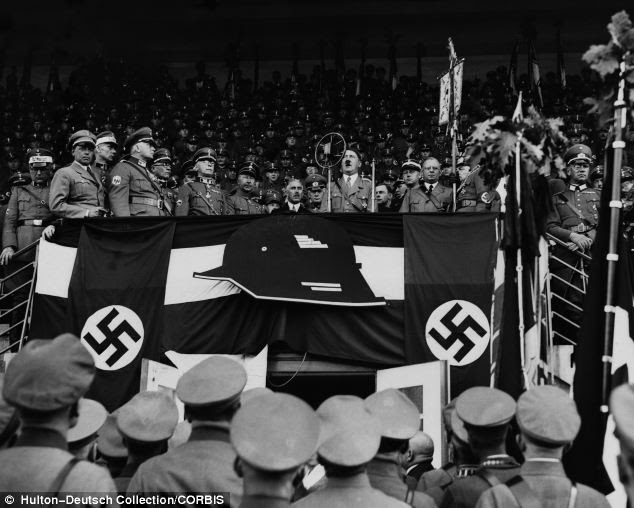 Infiltrate: Adolf Hitler speaks to a crowd of German soldiers at a large rally in Hannover
