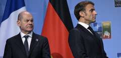 German Chancellor Olaf Scholz (L) and French President Emmanuel Macron attend an event with G7 leaders to announce a Joint Declaration of Support for Ukraine during the NATO Summit in Vilnius on July 12, 2023. (Photo by ANDREW CABALLERO-REYNOLDS / AFP)