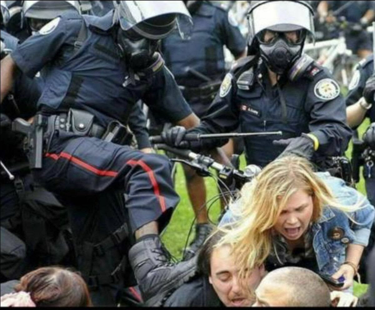 Cops kicking people.