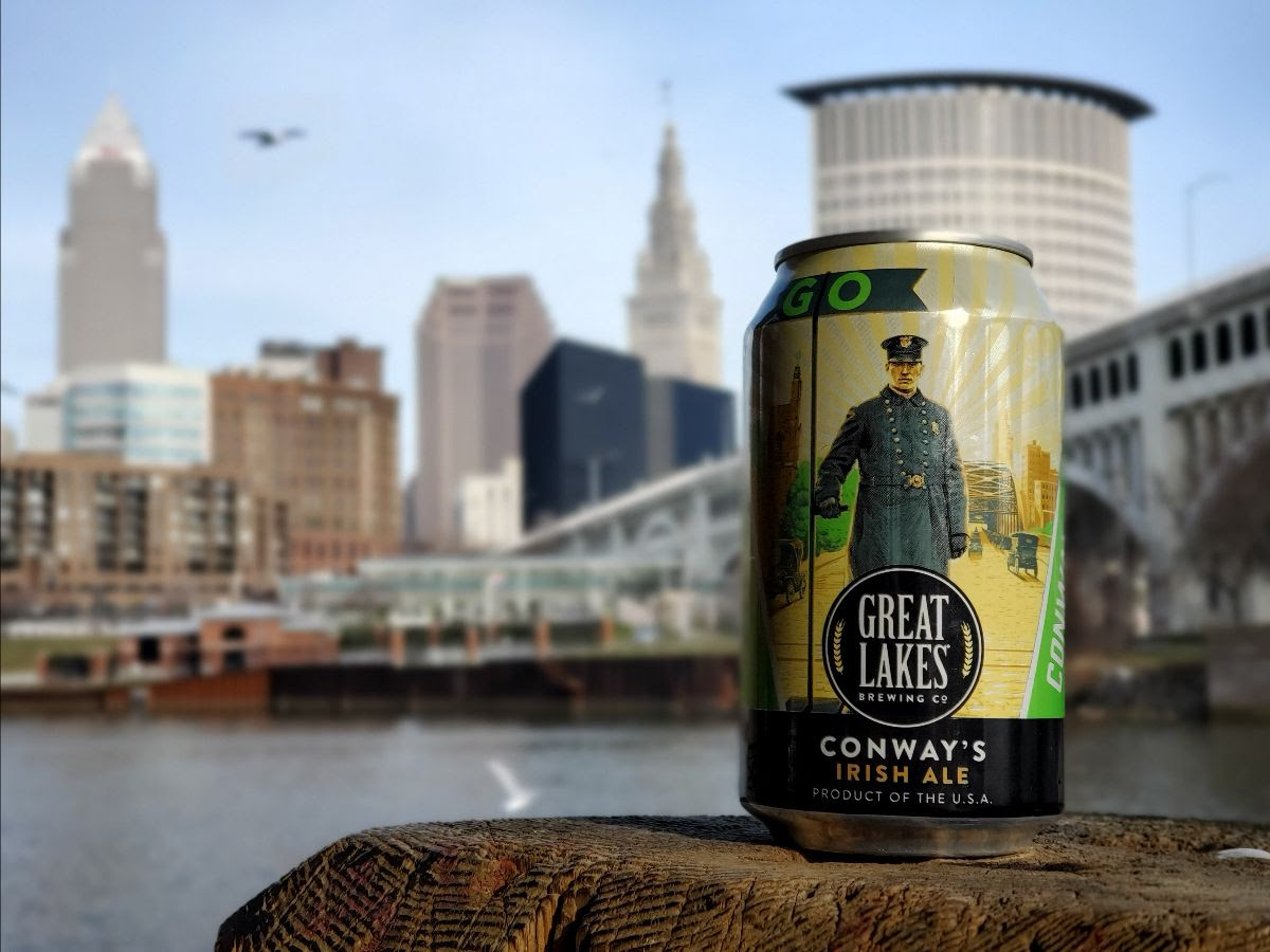 Can of Conway's Irish Ale in front of the Cleveland skyline.