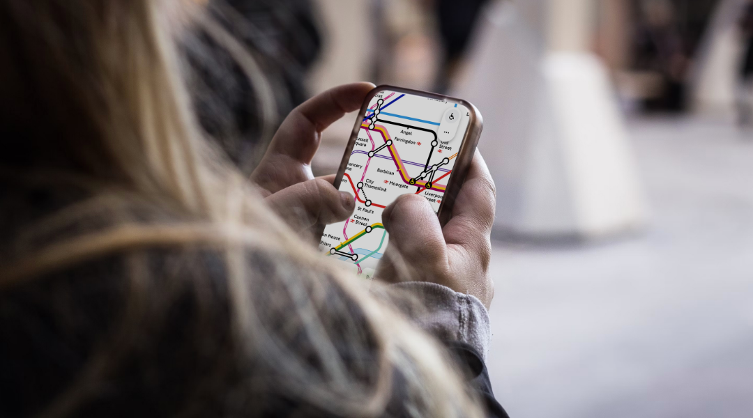 Woman using TfL Go to plan a journey