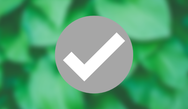 Tick icon on green blurred background