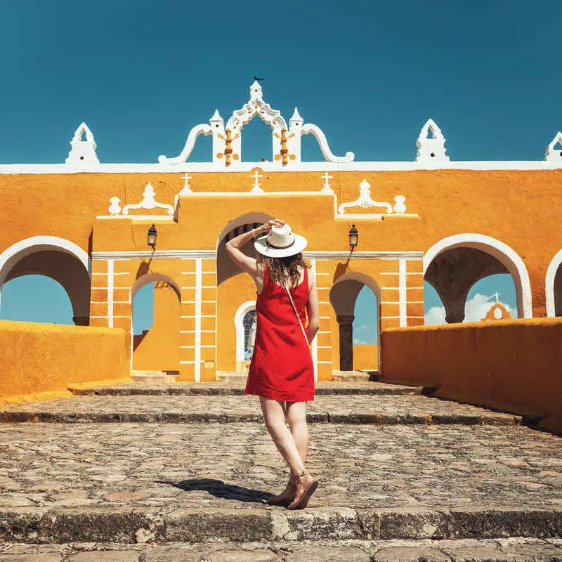 Young Female Tourist In Izamal, The Yellow City Of Yucatan, Mexico
