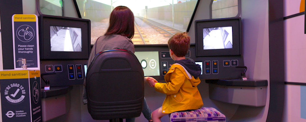 A mother and child on the Elizabeth line train driving experience