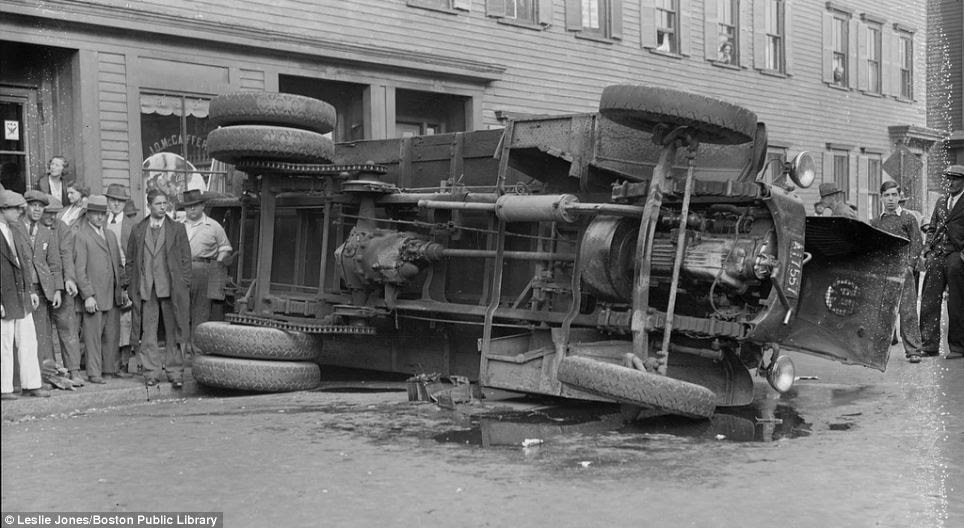 A bus hit a truck and flipped over in south Boston, stopping just before it smashed into a cafeteria storefront