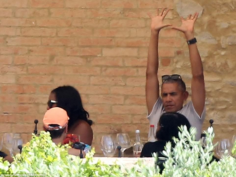 Reach up! Barack enjoyed a nice big stretch at the table, having just completed a lengthy bike ride in the Tuscan sun