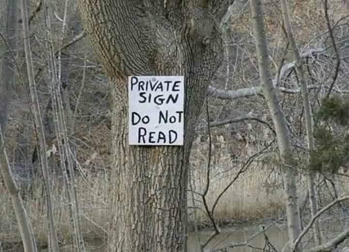 Photo of sign in the woods that says "do not read."