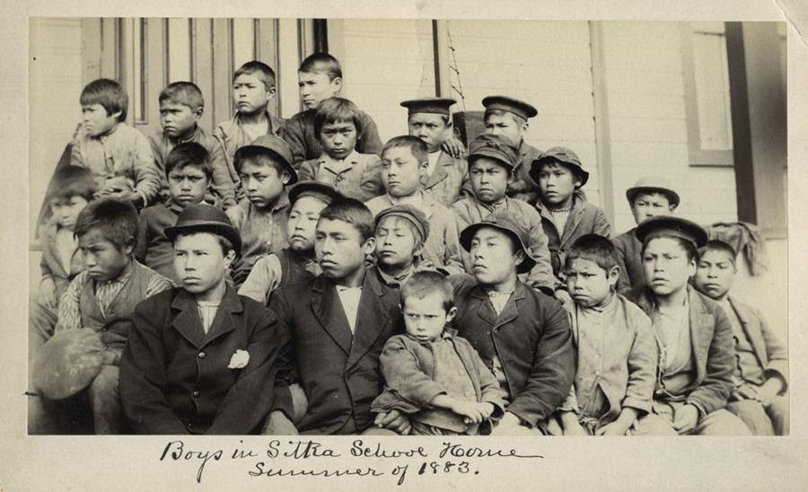 This photo made available by the Presbyterian Historical Society, Philadelphia shows students at a Presbyterian boarding school in Sitka, Alaska in the summer of 1883. U.S. Catholic and Protestant denominations operated more than 150 boarding schools between the 19th and 20th centuries. Native American and Alaskan Native children were regularly severed from their tribal families, customs, language and religion and brought to the schools in a push to assimilate and Christianize them.