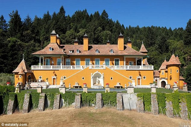 Fit for a king: This yellow and white five-bedroom home in St Helena, California is currently listed for $18,950,000 while featuring a swimming pool in its front