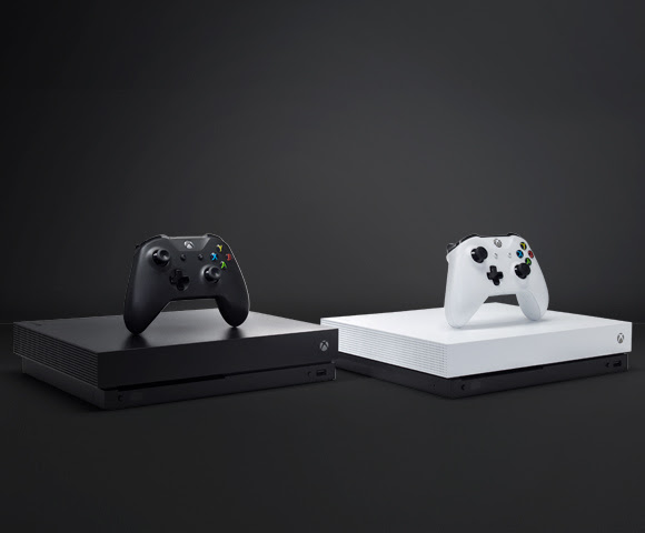 Xbox One X consoles with their respective controllers.