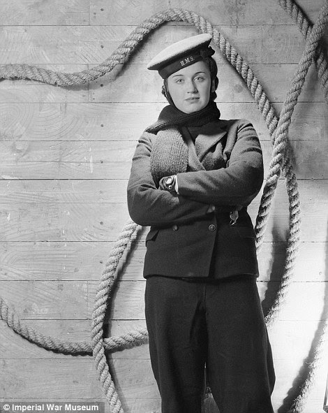 Dressed to impress: Smartly-dressed Flight Lieutenant David Donaldson of No 149 squadron RAF poses for a Beaton portrait, while right, a wren serving with the crew of a harbour launch in Portsmouth, 1941