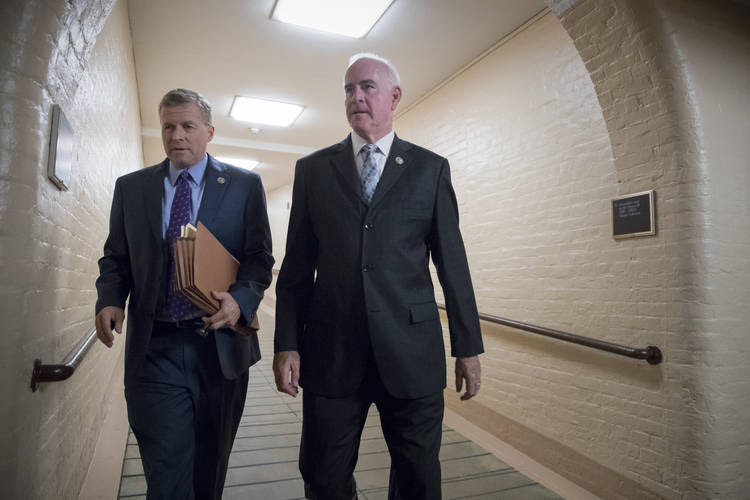 Rep. Charlie Dent, left, and Rep. Pat Meehan walk to a meeting with fellow House Republicans at the Capitol on Wednesday. (J. Scott Applewhite/AP)
