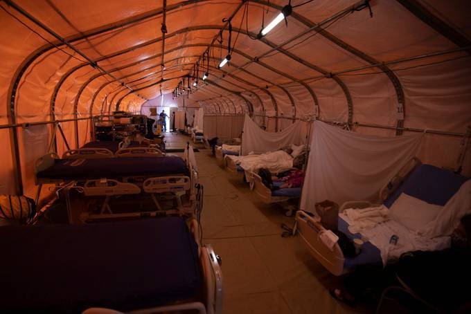 St. Mary Medical Center has resorted to using tents in their parking lot to handle an overflow of covid patients at its 200-bed hospital in Apple Valley, Calif. (Mike Blake/Reuters)