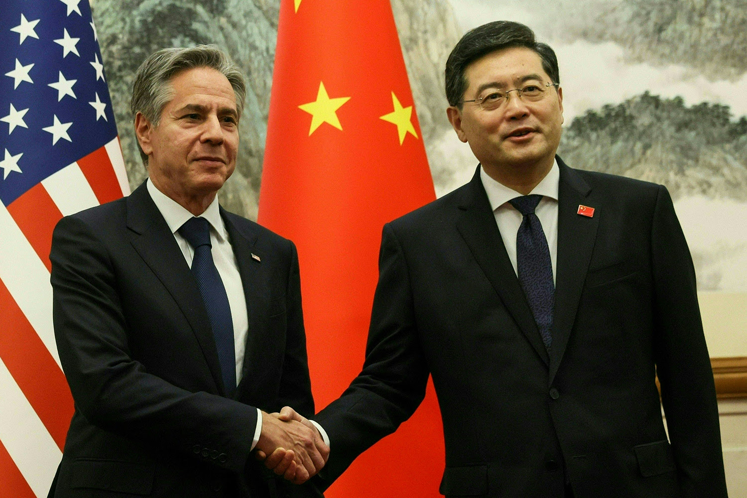 U.S. Secretary of State Antony Blinken, left, and Chinese Foreign Minister Qin Gang shake hands ahead of a meeting at the Diaoyutai State Guesthouse in Beijing on June 18. 
