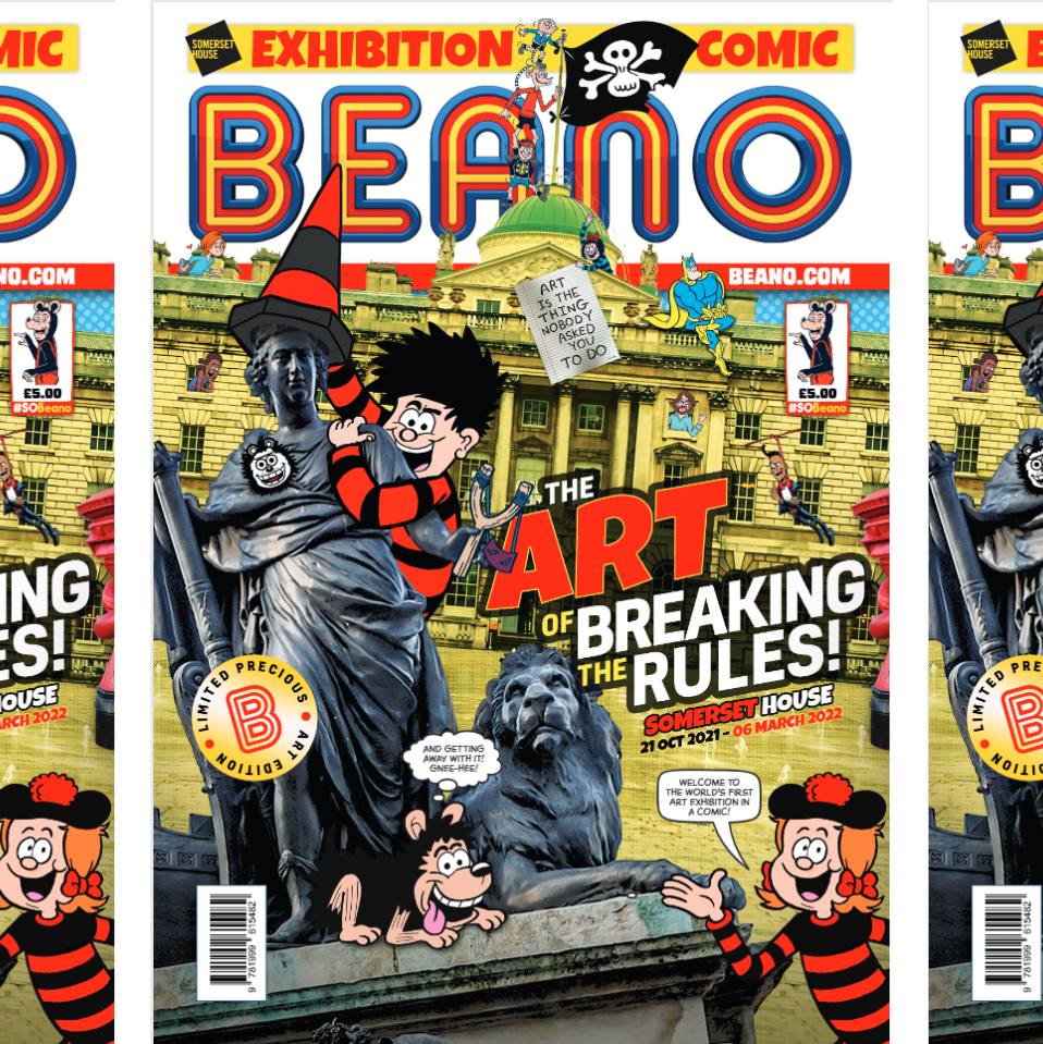 A photo of the front cover of the Beano exhibition comic. Dennis the Menace is climbing on a statue to put a traffic cone on its head.