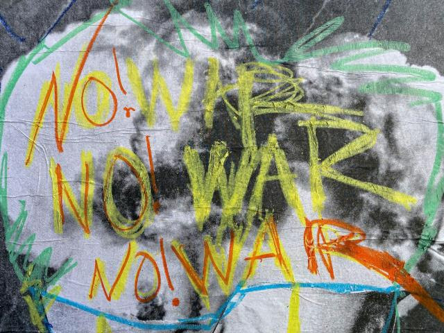 Spray paint with the words "No War"