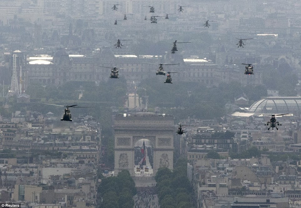 An impressive range of military transport helicopters and gun ships flew in formation through the heart of Paris as part of the festivities 