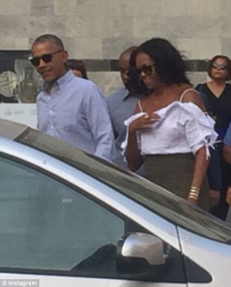 Living the life: The couple gamely waved at the waiting crowds as they made their way through the historic town