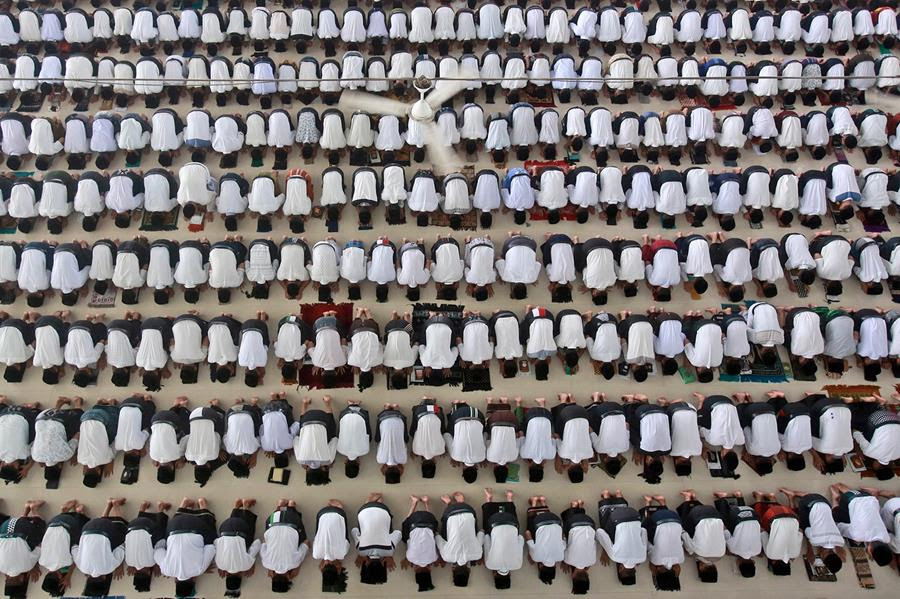 Students perform a noon prayer during the first day of the holy fasting month of Ramadan at Ar-Raudlatul Hasanah Islamic Boarding School in Medan, North Sumatra, Indonesia, Sunday, April 3, 2022.