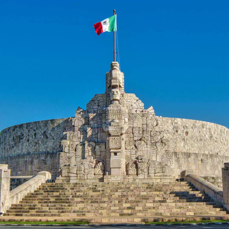 Mexican Flag Flying Atop A Historic Fort In Merida, Yucatan, Mexico