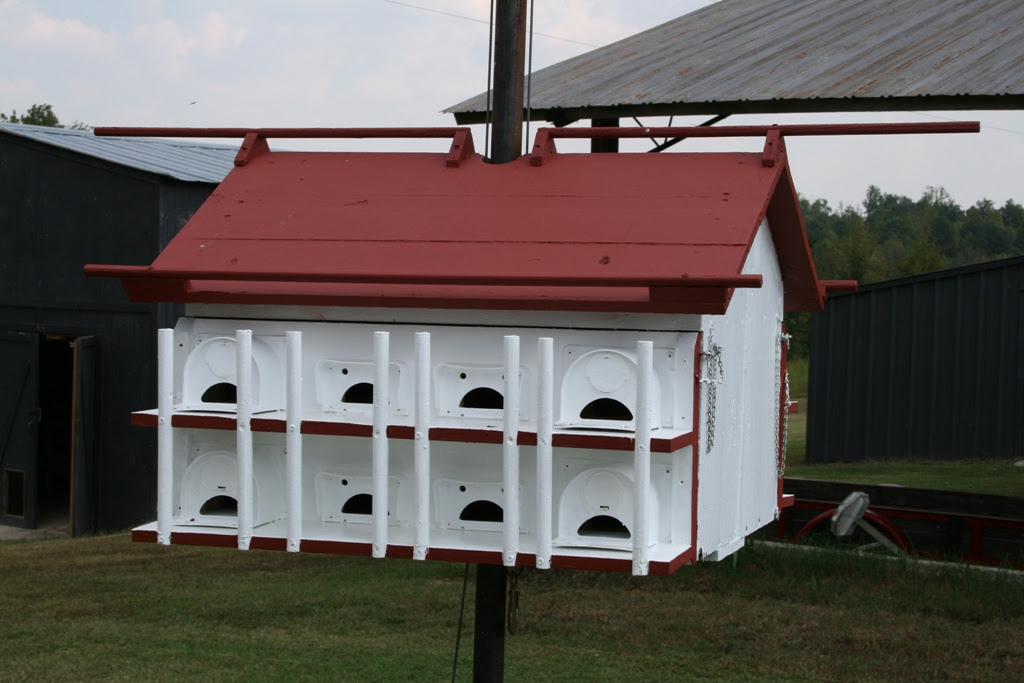 A wooden purple martin bird house that is capable of housing up to twelve separate purple martin families, this house features cozy apartments 5l x 5w x 5.25h. Purple Martin House