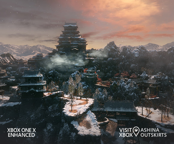 Pagodas elevated off the ground in a mountainous forest landscape, below a dusky pink sky.