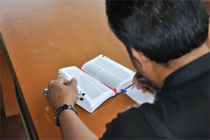 An man studying scripture