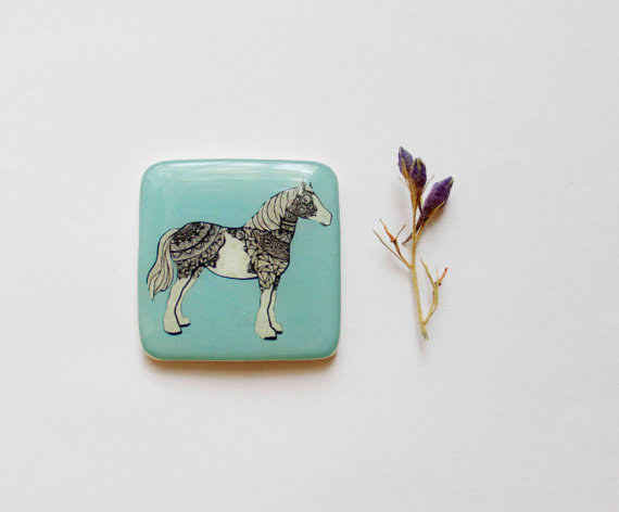 This elegantly embroidered magnet.