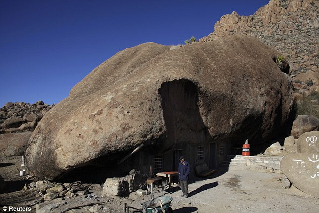 Home: Benito Hernandez stands outside his home near San Jose de Las Piedras in Mexico's northern state of Coahuila