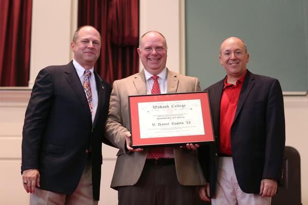 Rogers H'12 poses with Shook '83 and President Hess after being named an Honorary Alumnus.