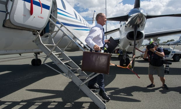  Queensland Premier Campbell Newman arrives back from Cairns in Brisbane on Thursday. Photograph: JOHN PRYKE/AAPIMAGE