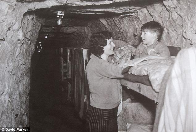 Bolthole: Bedtime in the bunker for a young boy sleeping safely in the vast burrow, which was built on the instigation of the town's far-sighted mayor Arthur Kempe, who remembered the raids of the last war