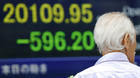 Global stocks plunge as Greece imposes controls on money