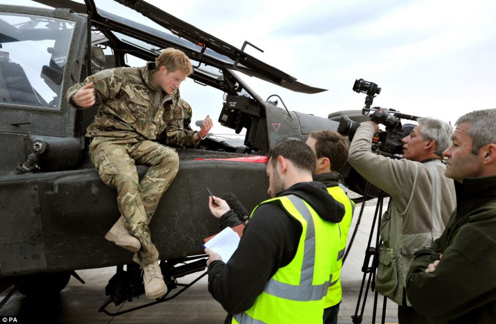 Prince Harry chats to reporters and a TV crew following the checks on his aircraft