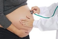 Pregnant woman with doctor