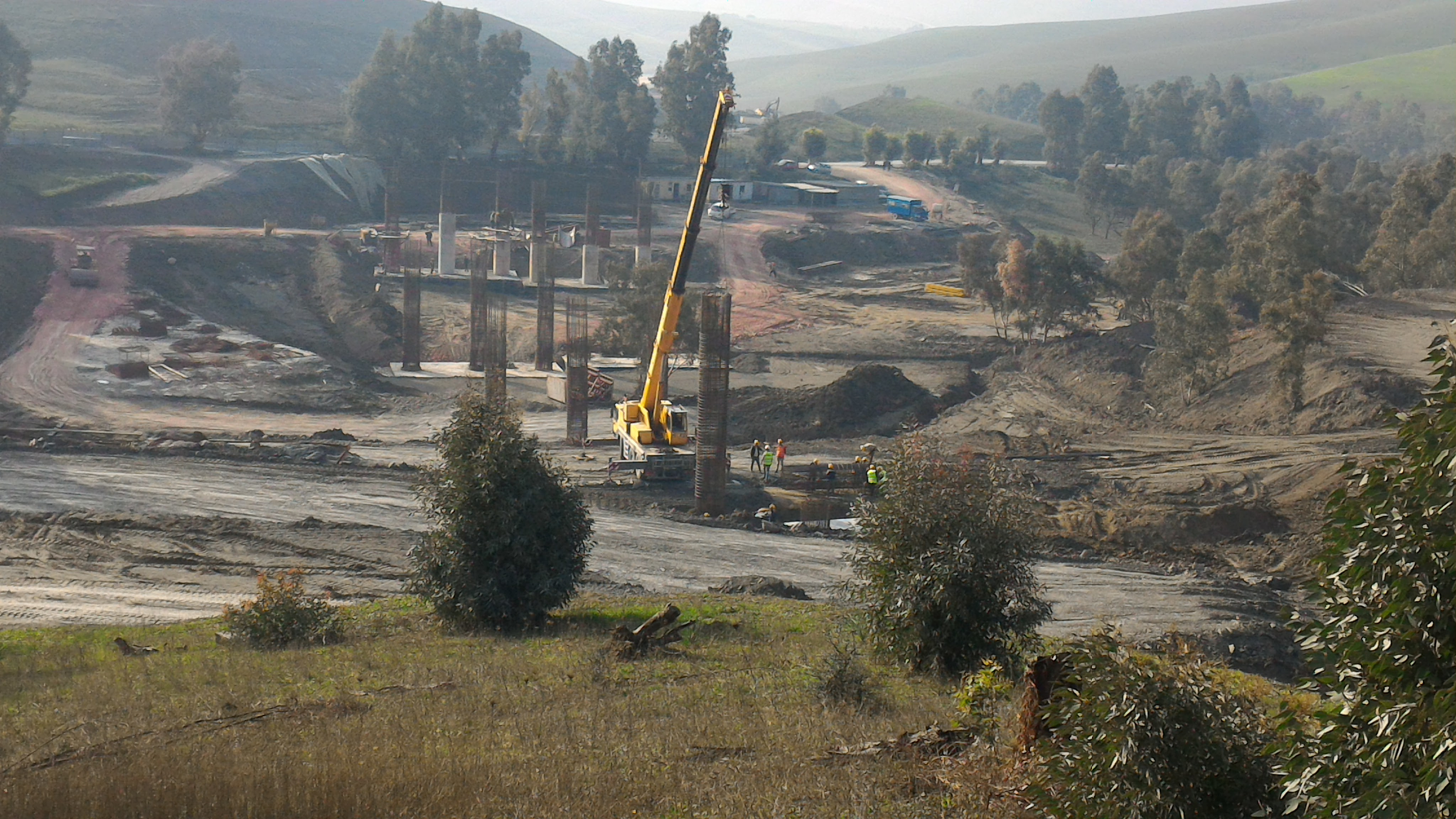 Several soft lines connect the rigid square buildings. Highway Penetration Link From Tizi Ouzou To The Algeria East West Highway At Djebahia
