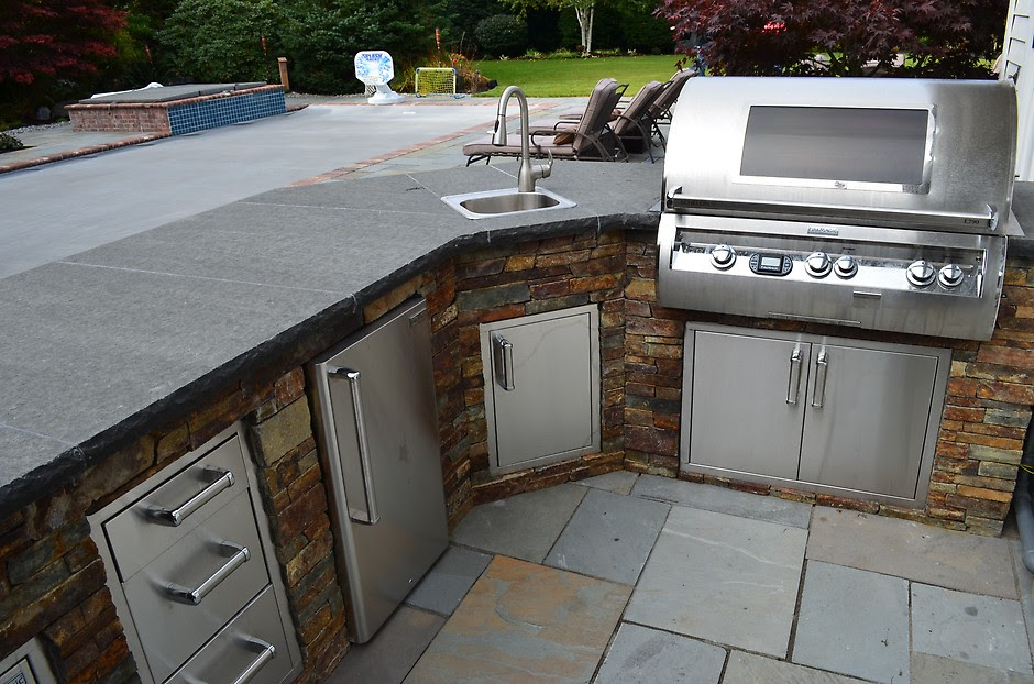 Building an outdoor kitchen island with diy concrete countertops. 7 Tips For Designing The Best Outdoor Kitchen