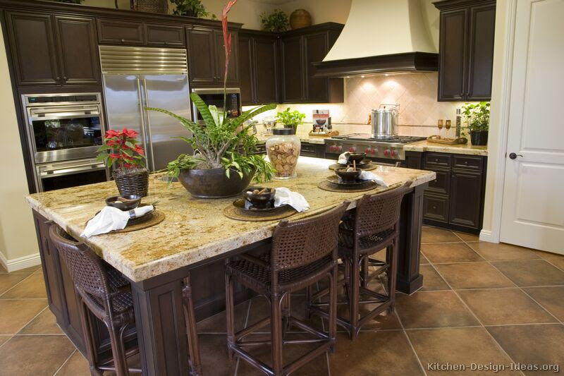 Dark wood shelves contrast beautifully against white subway tile and make a great place to store and display your dishes. Artistic Home Interior Designs Kitchen Of Dark Wood