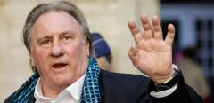 (FILES) In this file photo taken on June 25, 2018, French actor Gerard Depardieu waves as he arrives at the Town Hall in Brussels for a ceremony as part of the 'Brussels International Film Festival' (Briff). Nearly 60 French actors and other prominent figures have denounced the "lynching" of disgraced cinema legend Gerard Depardieu, who is charged with rape and facing a litany of sexual assault claims. "Gerard Depardieu is probably the greatest of all actors," said an open letter published in French newspaper Le Figaro late on December 25, 2023, Christmas Day. (Photo by THIERRY ROGE / BELGA / AFP) / Belgium OUT