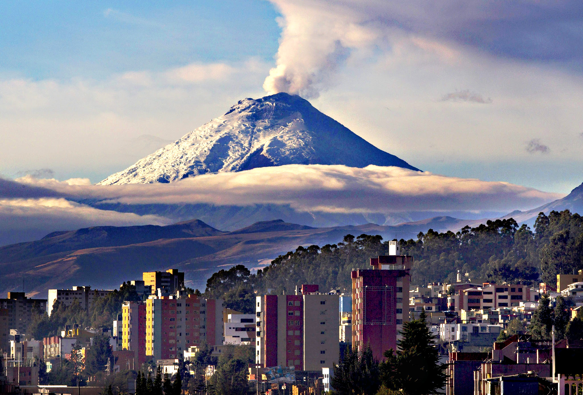 Cotopaxi volcano spews ash and steam near Quito, Ecuador, on Thursday. The Security Coordinator Ministry, based on reports from the Geophysical Institute (IG) of the National Polytechnic School, said that Cotopaxi volcano 'continues its moderate internal and surface activity with emissions of gases and water vapor containing a burden moderate ash.