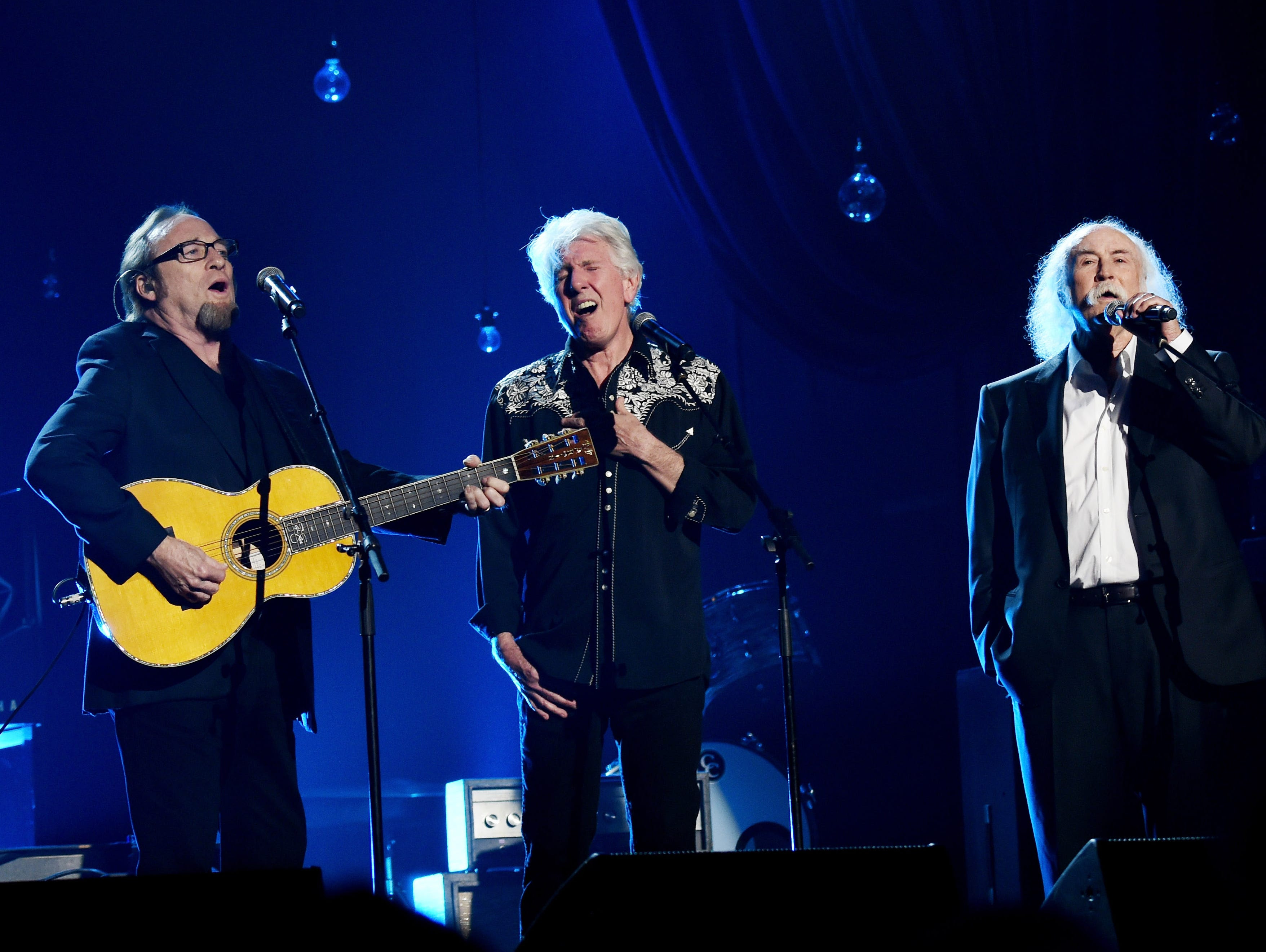 Musicians Stephen Stills, Graham Nash and David Crosby of Crosby, Stills & Nash perform onstage at the 25th anniversary MusiCares 2015 Person Of The Year Gala at the Los Angeles Convention Center.