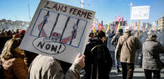 People take part in a demonstration in Marseille on January 31, 2023 as part of a nationwide day of strikes and rallies for the second time in a month to protest a planned reform to boost the age of retirement from 62 to 64. (Photo by NICOLAS TUCAT / AFP)