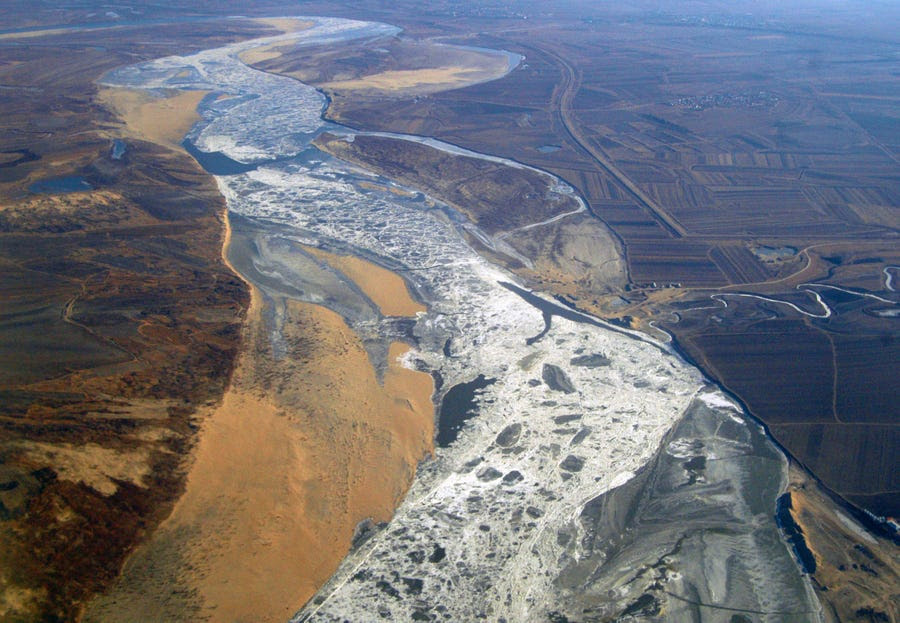 Potentially lethally polluted river water heads toward Harbin, one of China's largest cities at 9 million people, after an explosion at a petrochemical plant in November 2005. 