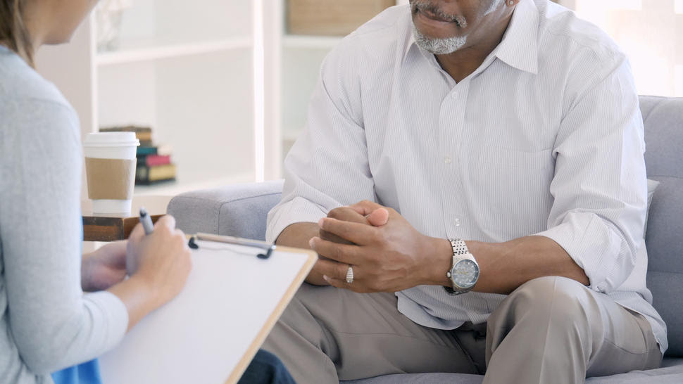 African American man speaking with health care provider