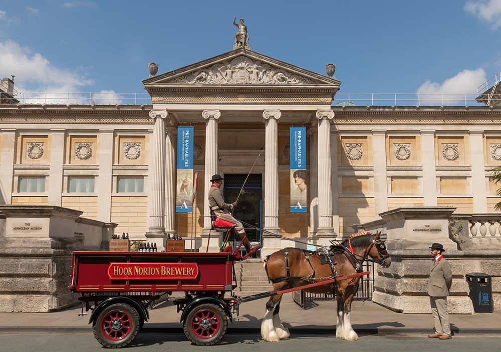 A traditional delivery, led by Heavy Horse, takes place outside the Ashmolean Museum