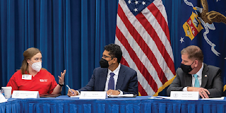 Secretary Walsh and Assistant Secretary for Policy Raj Nayak listen to a nurse at a roundtable in D.C.