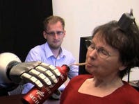 Watch this paralyzed woman pick up a cup with her mind