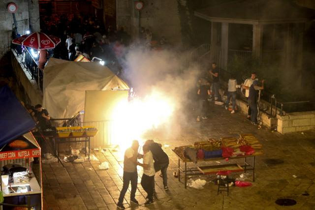 Photo showing a stun grenade exploding during clashes outside the Damascus Gate of Jerusalem's Old City.