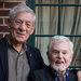 Ian McKellen, left, and Derek Jacobi, on the balcony of their Midtown hotel, will be grand marshals at Sunday's Gay Pride March.